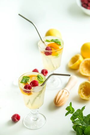 fresh homemade lemonade with metal straw on white backの写真素材