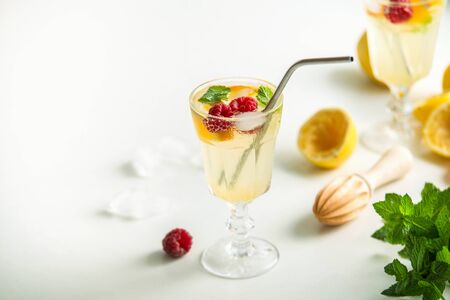 fresh homemade lemonade with metal straw on white backの写真素材