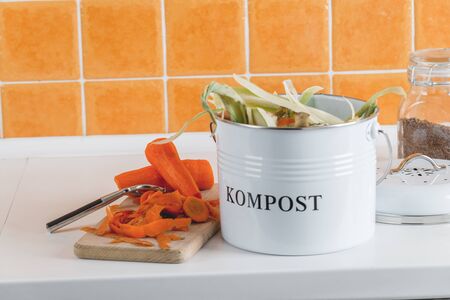 trash bin for composting with leftover in the kitchen with copy spaceの写真素材