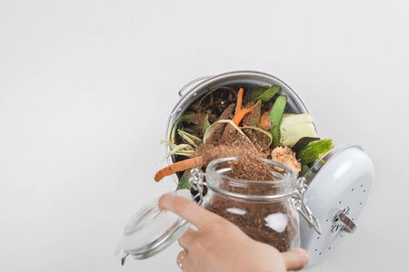 trash bin for composting with leftover from kitchen. concept of recycling scarps