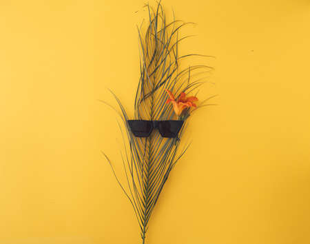 ummer background with straw hat and bag and palm leaves
