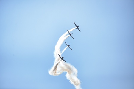 Acrobatric airplanes on blue cloudy sky during airshow Turin Italy circa June 2016