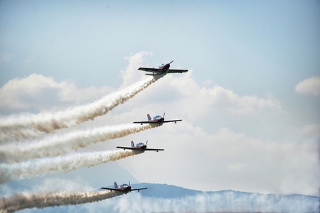 Acrobatric airplanes on blue cloudy sky during airshow Turin Italy circa June 2016