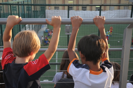 Children playing soccer football with instructorの写真素材