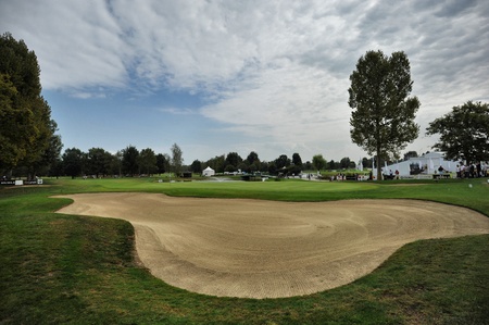 urin Italy about September empty golf course green and fairway panoramic view with bunker in foregroundのeditorial素材