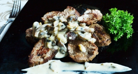 veal in a cream sauce with mushroomsの写真素材