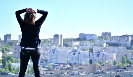 figure of a woman on the background of a panorama of the city