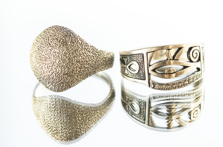 silver rings on the mirror surfaceの写真素材