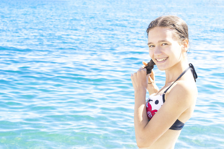 girl with wet hair near the seaの写真素材