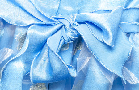 lace bow on a blue dressの写真素材