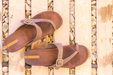 old flip-flops on the beachの写真素材