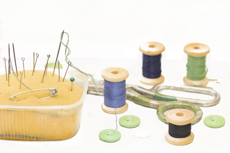 old metal needles, pins and scissors