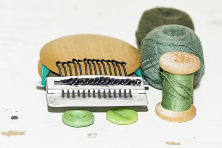 old wooden machine for darning, thread, buttons