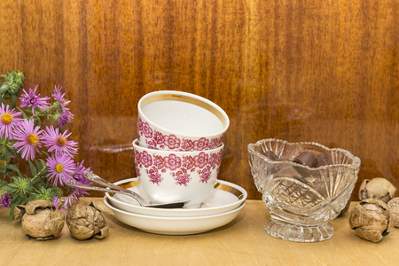 chocolate in a vase, two cups and spoons, flowersの写真素材