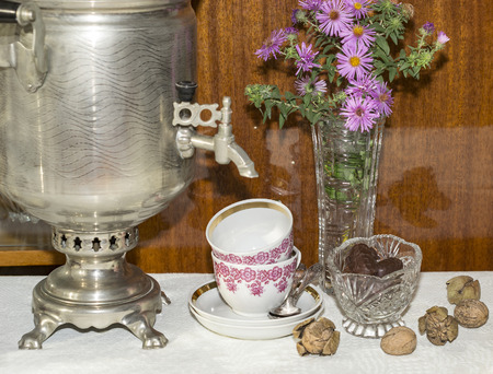 samovar, tea cups and chocolatesの写真素材