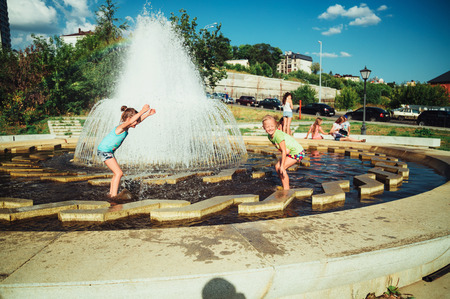 Children swimming in the pond and swimの写真素材