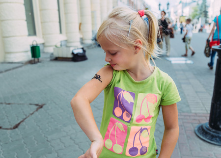children walking around the city, the sun shinesの写真素材