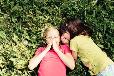children playing in the summer in the woodsの写真素材