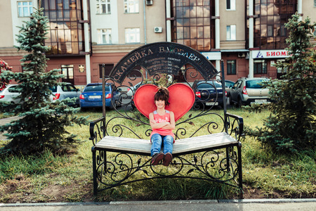 little girl walks in summer cityのeditorial素材