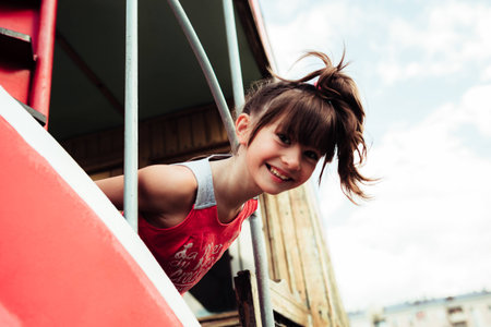 little girl walks in summer cityの写真素材