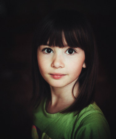child portrait, expressive eyes of a little girlの写真素材