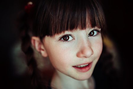 child portrait, expressive eyes of a little girlの写真素材