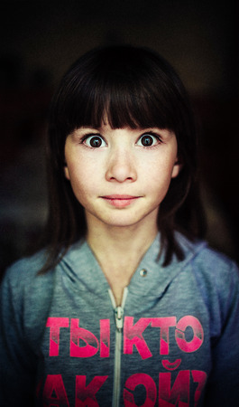 child portrait, expressive eyes of a little girlの写真素材