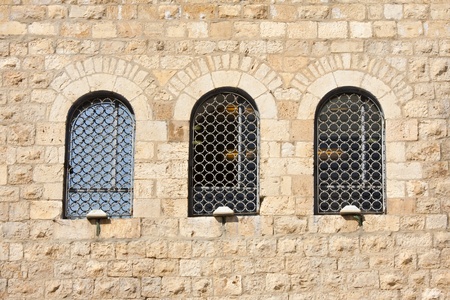 Old wall made from Jerusalem stone with  windows の写真素材