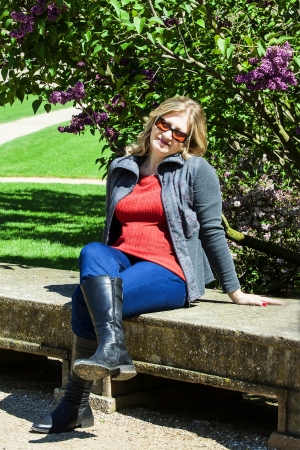 woman rests under a lilac bushの写真素材