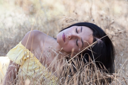 woman sleeping in the strawの写真素材