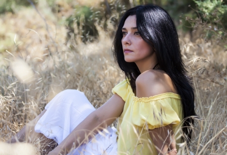 woman seated  in the strawの写真素材