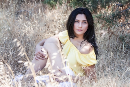 woman seated  in the strawの写真素材