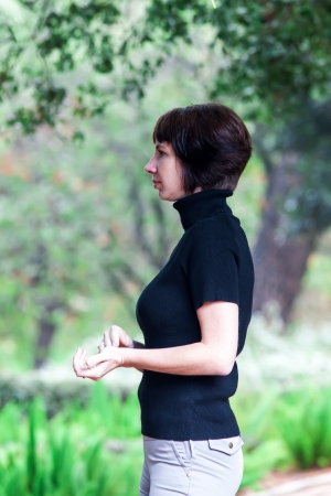 beautiful woman posing in the parkの写真素材