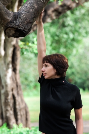 beautiful woman posing in the parkの写真素材