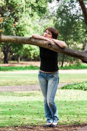 beautiful woman posing in the parkの写真素材