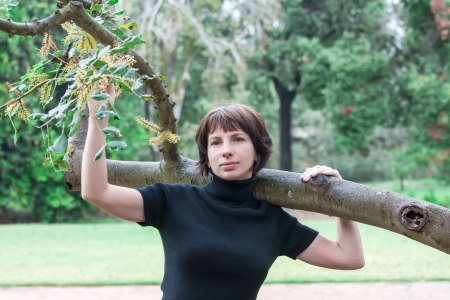 beautiful woman posing in the parkの写真素材