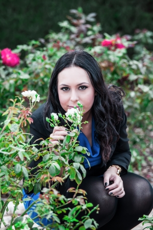 young woman smelling a roseの写真素材