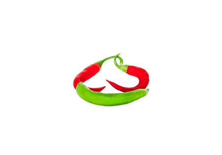 Red and green chilli peppers isolated on whiteの写真素材