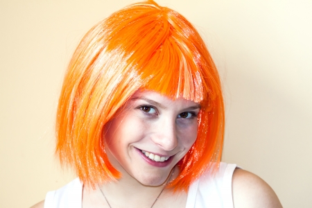 Happy pretty girl with orange hairの写真素材