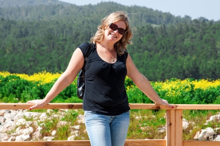 woman enjoying the fresh air in green forestの写真素材