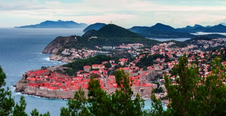 Classic red tiled rooftops with Adriatic seaの写真素材