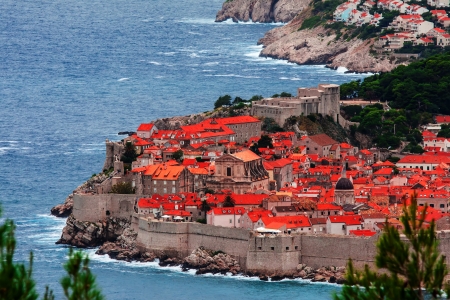 Classic red tiled rooftops with Adriatic seaの写真素材