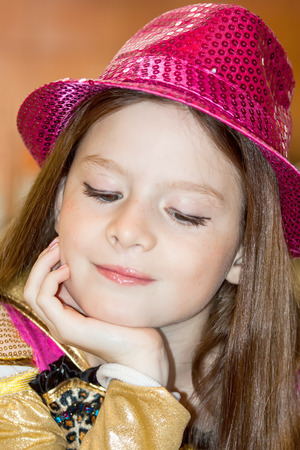 emotional young girl in red hatの写真素材