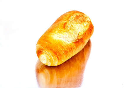 fresh baked rolls in a basket on  mirror surfaceの写真素材