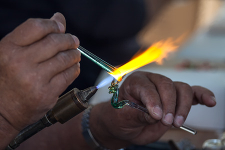 Artist works on glassの写真素材