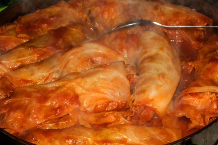 Stuffed cabbage rolls with rice and mushrooms in tomato sauceの写真素材