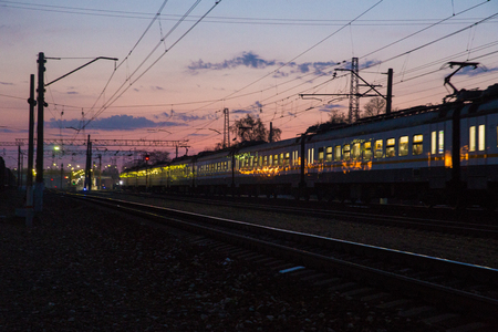 Electric train in Sunset approaching to station Nakhabinoの写真素材