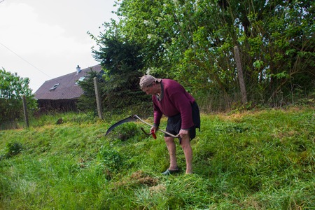 the man mows the grass in Normandy near Rouen MAY 13 m 2016の写真素材