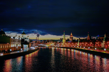 Moscow River: right side - Kremlin. The Kremlin has the longest walls in the world 2.2 km. Left side - The Cathedral of Christos Savior - famous Post-Communist Russia Building. View from Bolshoi Kamennyi bridgeの写真素材