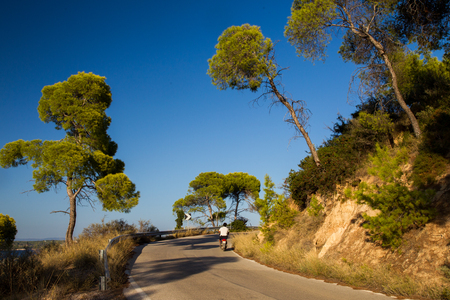 Bicycle and scooter - sportive recreation on Spetses, Greece. here is clean air and waterの写真素材